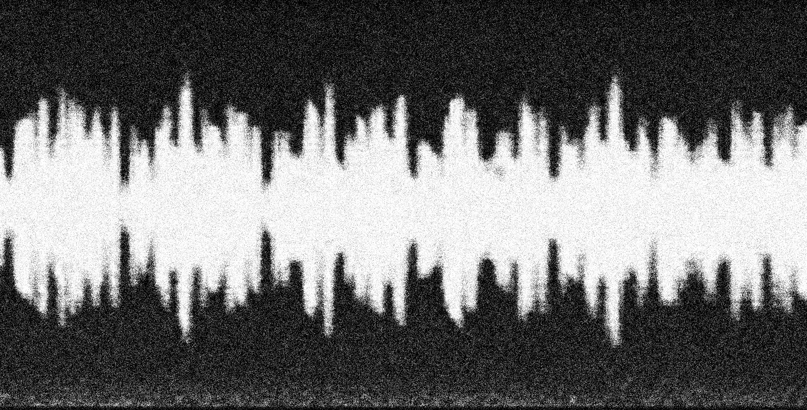 A grainy black-and-white close-up image showing a section of optical sound on film.